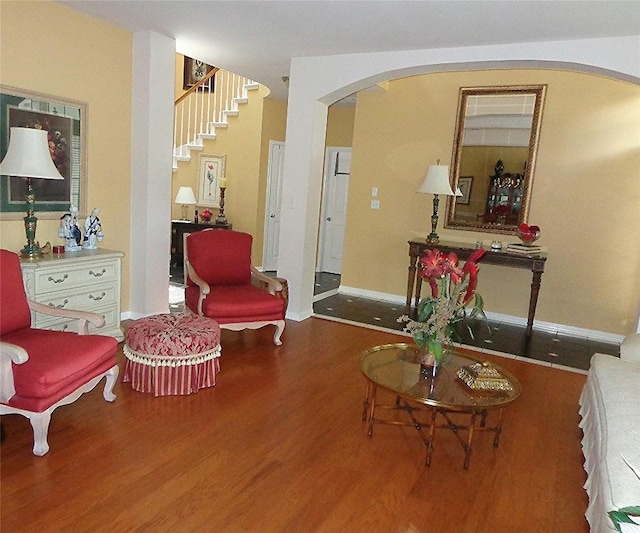 4003 Wyman Cv, Round Rock, TX 78681 - living room with arched walkways, wood finished floors, and baseboards