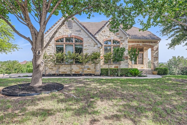 205 Sebastians Run, Austin, TX 78738 - view of front of property with stone siding and a front lawn