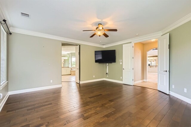 205 Sebastians Run, Austin, TX 78738 - unfurnished living room with ceiling fan, arched walkways, dark wood-style floors, and ornamental molding