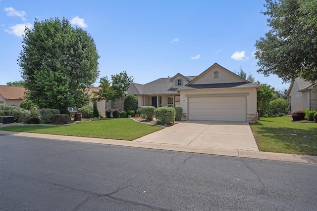 259 Red Poppy Trl, Georgetown, TX 78633 - view of front of home featuring a front lawn, stucco siding, a garage, driveway, and stone siding