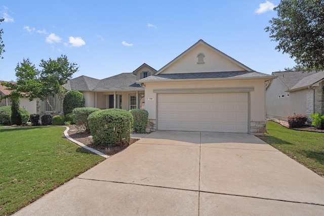 259 Red Poppy Trl, Georgetown, TX 78633 - traditional-style house featuring stucco siding, driveway, a front lawn, stone siding, and a garage