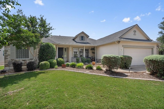 259 Red Poppy Trl, Georgetown, TX 78633 - view of front of house featuring stone siding, covered porch, a front lawn, stucco siding, and a garage