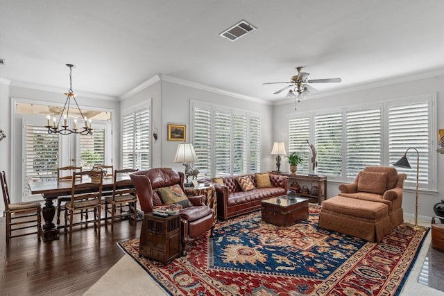 259 Red Poppy Trl, Georgetown, TX 78633 - living area with ceiling fan, a chandelier, healthy amount of natural light, wood finished floors, and ornamental molding