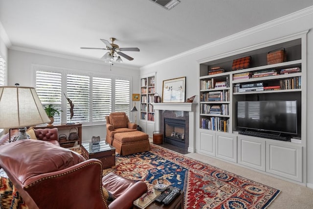 259 Red Poppy Trl, Georgetown, TX 78633 - carpeted living area with ceiling fan, a high end fireplace, ornamental molding, and built in features