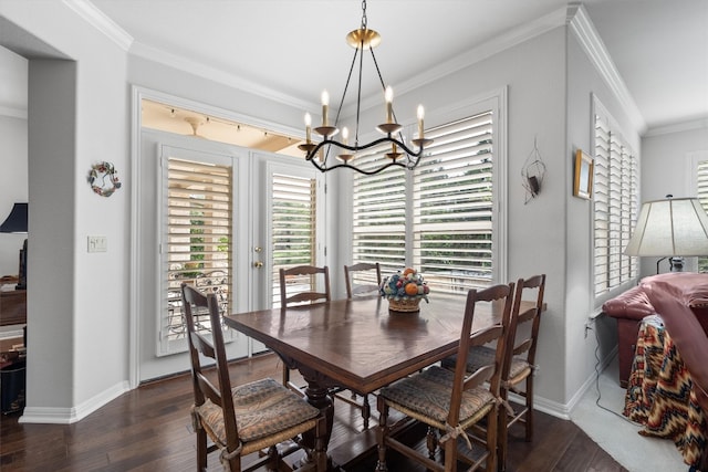 259 Red Poppy Trl, Georgetown, TX 78633 - dining area featuring a chandelier, dark wood-style floors, crown molding, and plenty of natural light