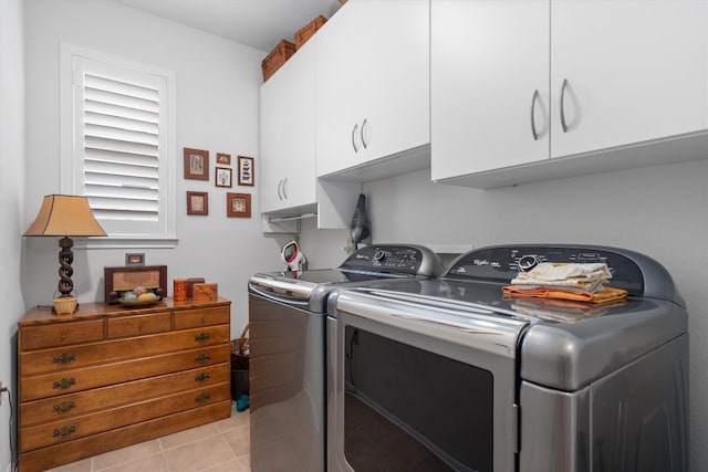 259 Red Poppy Trl, Georgetown, TX 78633 - washroom with cabinet space, independent washer and dryer, and light tile patterned flooring