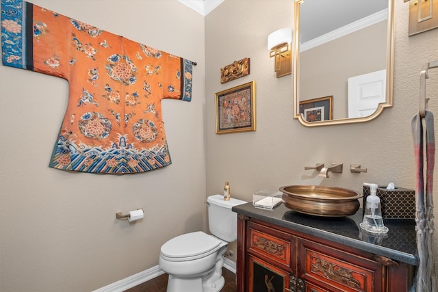259 Red Poppy Trl, Georgetown, TX 78633 - bathroom with crown molding, toilet, vanity, and baseboards