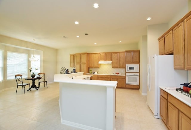 115 Blazing Star Dr, Georgetown, TX 78633 - kitchen with white appliances, light tile patterned flooring, light countertops, recessed lighting, and decorative backsplash