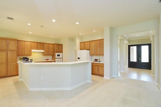 115 Blazing Star Dr, Georgetown, TX 78633 - kitchen featuring white appliances, recessed lighting, french doors, backsplash, and a large island