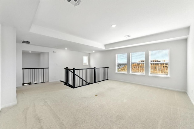 spare room featuring carpet flooring, recessed lighting, and baseboards
