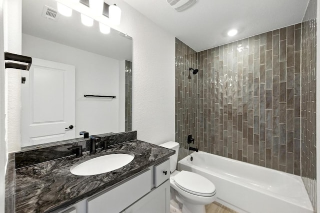 full bath featuring toilet, shower / washtub combination, and vanity