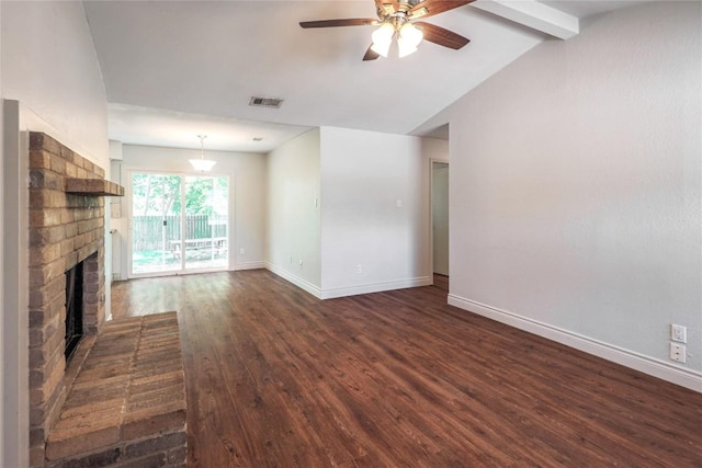 16213 Malden Dr, Pflugerville, TX 78660 - unfurnished living room featuring a ceiling fan, dark wood-style flooring, and a brick fireplace