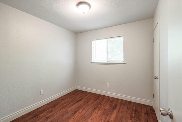 16213 Malden Dr, Pflugerville, TX 78660 - unfurnished room with baseboards and wood finished floors