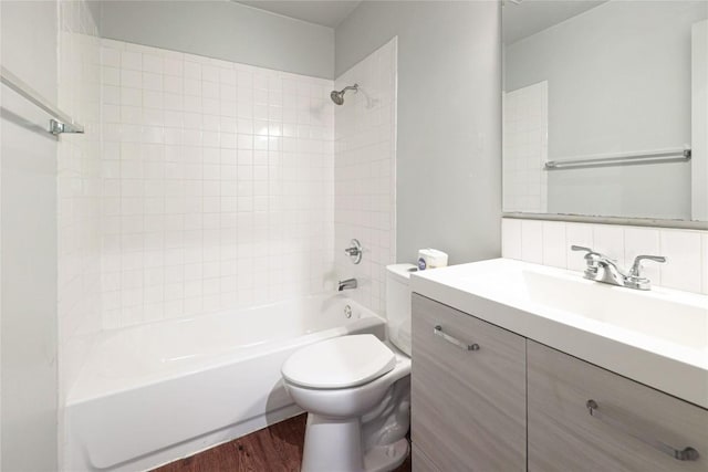 16213 Malden Dr, Pflugerville, TX 78660 - bathroom featuring vanity, shower / washtub combination, and wood finished floors
