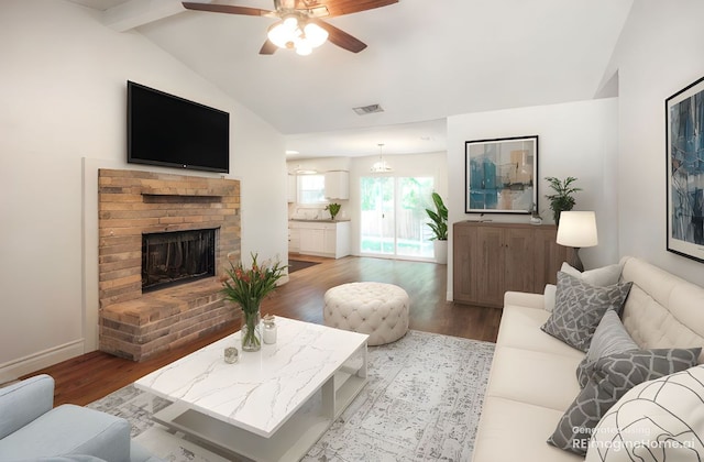 16213 Malden Dr, Pflugerville, TX 78660 - living area featuring a ceiling fan, wood finished floors, and a brick fireplace