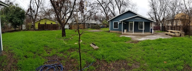 view of yard with covered porch and a patio area