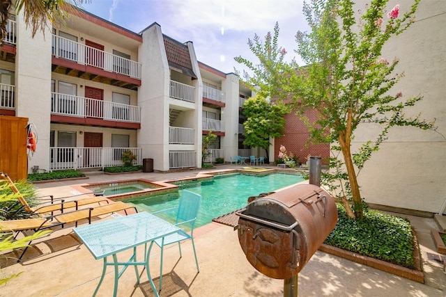 3115 Helms St Unit 115, Austin, TX 78705 - view of swimming pool featuring a pool with connected hot tub