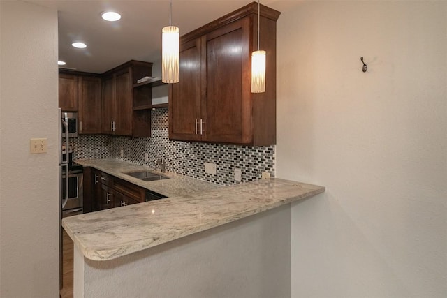 3115 Helms St Unit 115, Austin, TX 78705 - kitchen with backsplash, a peninsula, open shelves, dark brown cabinetry, and recessed lighting