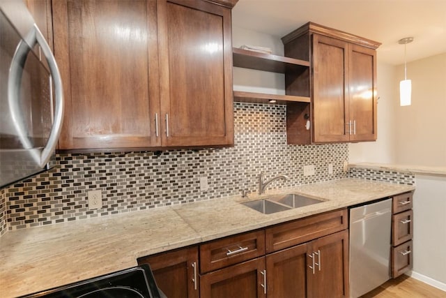 3115 Helms St Unit 115, Austin, TX 78705 - kitchen featuring appliances with stainless steel finishes, open shelves, tasteful backsplash, and pendant lighting