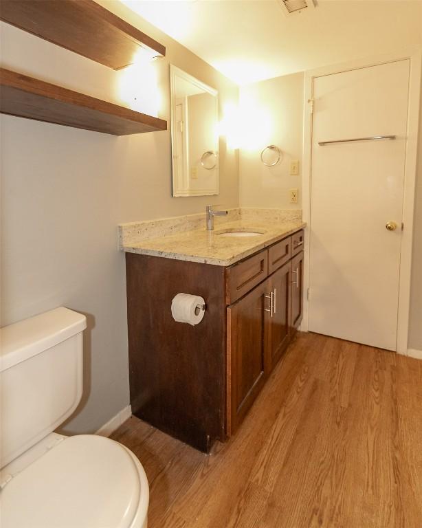 3115 Helms St Unit 115, Austin, TX 78705 - bathroom featuring wood finished floors and vanity