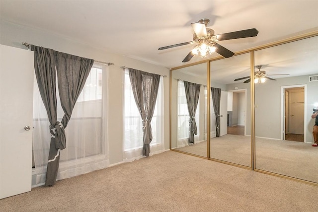 3115 Helms St Unit 115, Austin, TX 78705 - unfurnished bedroom featuring carpet, a closet, and ceiling fan