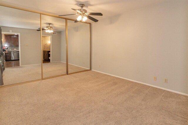 3115 Helms St Unit 115, Austin, TX 78705 - unfurnished bedroom featuring carpet floors, a closet, and a ceiling fan