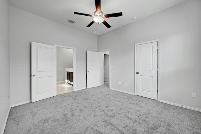 12725 Bloomington Dr Unit 129, Austin, TX 78748 - unfurnished bedroom with carpet floors, baseboards, and connected bathroom