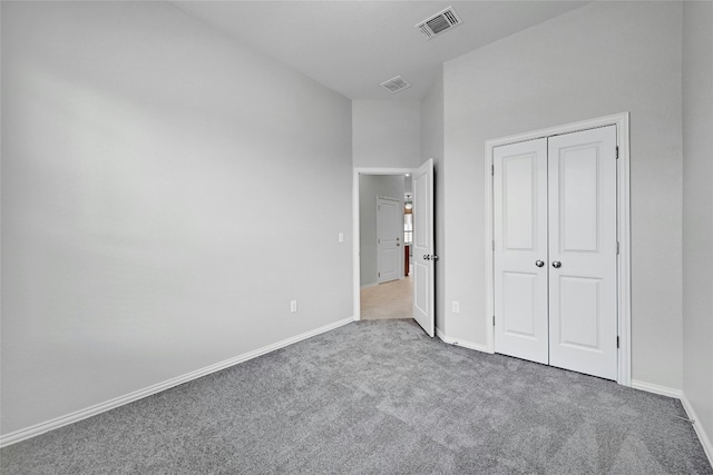 12725 Bloomington Dr Unit 129, Austin, TX 78748 - unfurnished bedroom featuring carpet floors, baseboards, and a closet