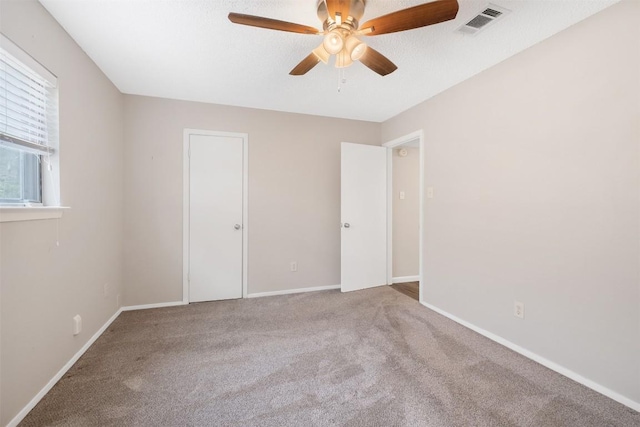 7503 Islander Dr, Austin, TX 78749 - unfurnished bedroom with carpet, baseboards, and a ceiling fan