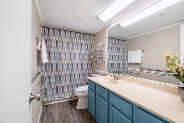 7503 Islander Dr, Austin, TX 78749 - full bath with toilet, wood finished floors, vanity, and crown molding
