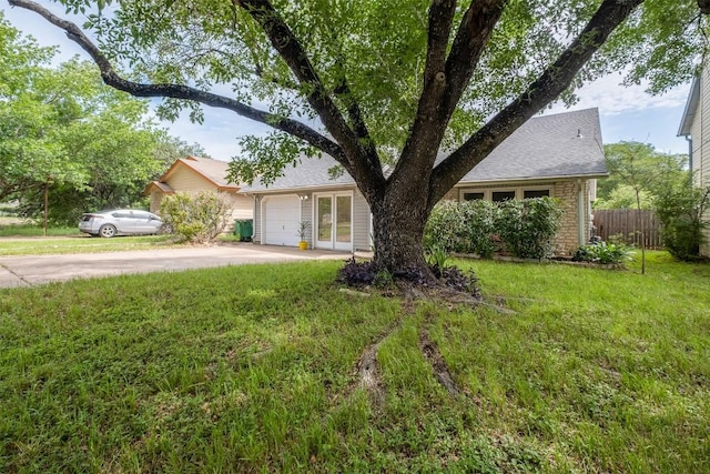 7503 Islander Dr, Austin, TX 78749 - view of front of property with driveway, a garage, and a shingled roof
