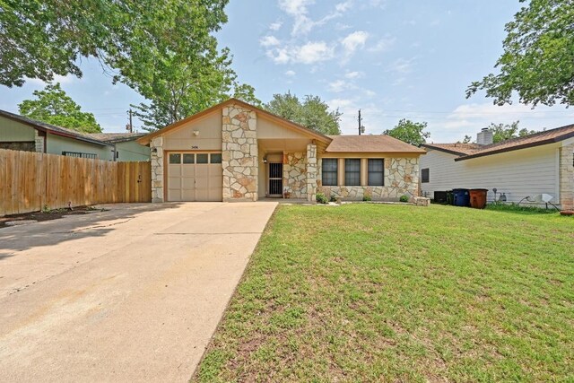 5406 Fence Row, Austin, TX 78744 - view of front facade featuring stone siding, an attached garage, and concrete driveway