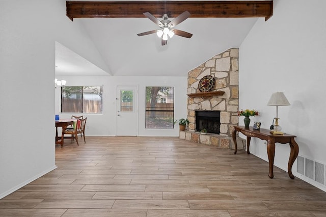 5406 Fence Row, Austin, TX 78744 - living room with beam ceiling, ceiling fan, plenty of natural light, wood finished floors, and high vaulted ceiling