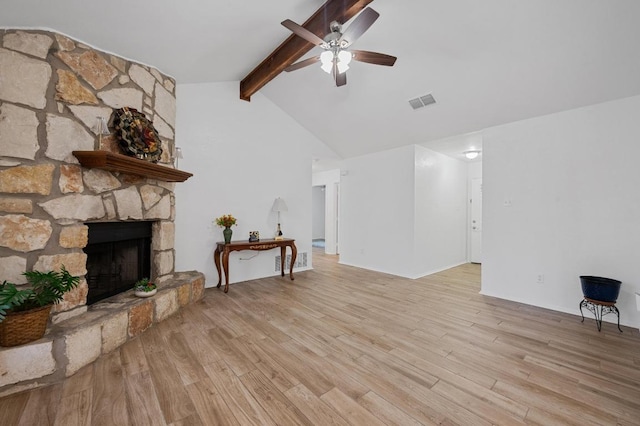 5406 Fence Row, Austin, TX 78744 - living area featuring ceiling fan, light wood-type flooring, and a stone fireplace