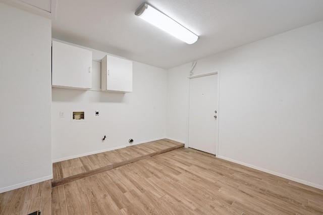 5406 Fence Row, Austin, TX 78744 - washroom with hookup for an electric dryer, washer hookup, light wood-type flooring, and hookup for a gas dryer