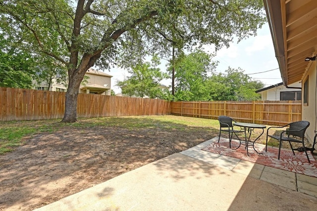 fenced backyard with a patio