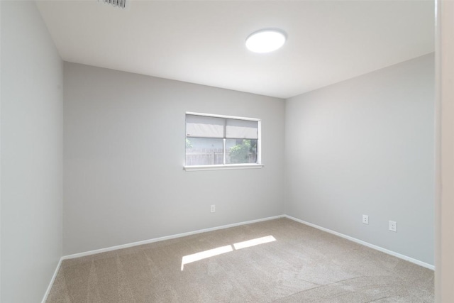12602 Pluto Ln, Austin, TX 78727 - carpeted spare room featuring baseboards
