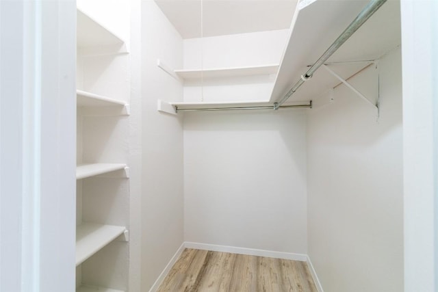 12602 Pluto Ln, Austin, TX 78727 - spacious closet featuring wood finished floors