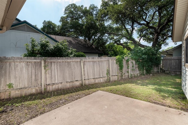 12602 Pluto Ln, Austin, TX 78727 - fenced backyard featuring a patio