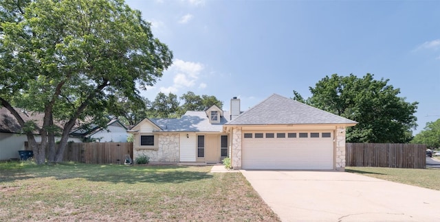 12602 Pluto Ln, Austin, TX 78727 - view of front of property with stone siding, a garage, concrete driveway, and a chimney