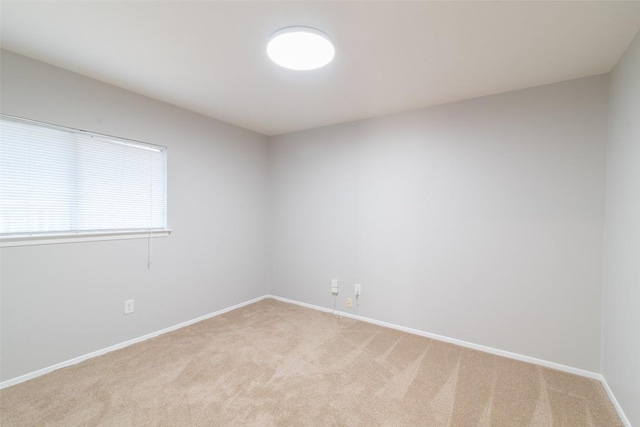 12602 Pluto Ln, Austin, TX 78727 - spare room featuring light colored carpet and baseboards