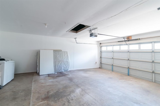12602 Pluto Ln, Austin, TX 78727 - garage featuring a garage door opener and independent washer and dryer