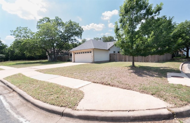 12602 Pluto Ln, Austin, TX 78727 - view of home's exterior with a garage and driveway