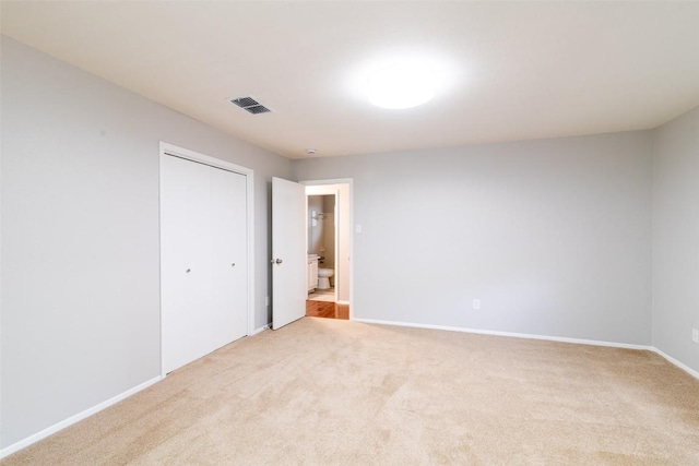 12602 Pluto Ln, Austin, TX 78727 - unfurnished bedroom featuring light colored carpet and a closet