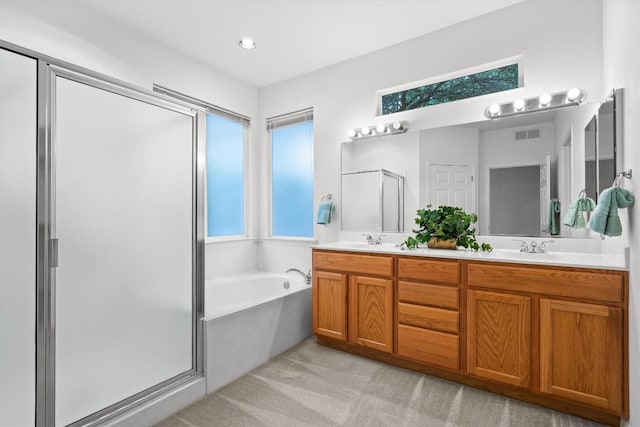 106 Ranch House Cv, Georgetown, TX 78633 - full bathroom featuring a shower stall, double vanity, and a garden tub