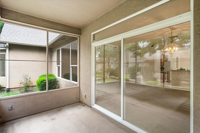 106 Ranch House Cv, Georgetown, TX 78633 - unfurnished sunroom featuring a chandelier