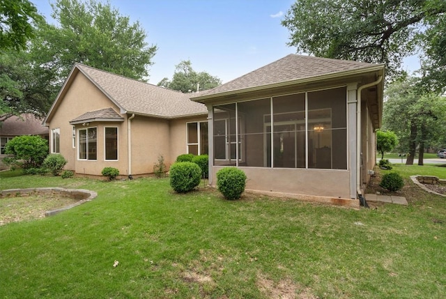 106 Ranch House Cv, Georgetown, TX 78633 - rear view of house featuring roof with shingles, a lawn, a sunroom, and stucco siding