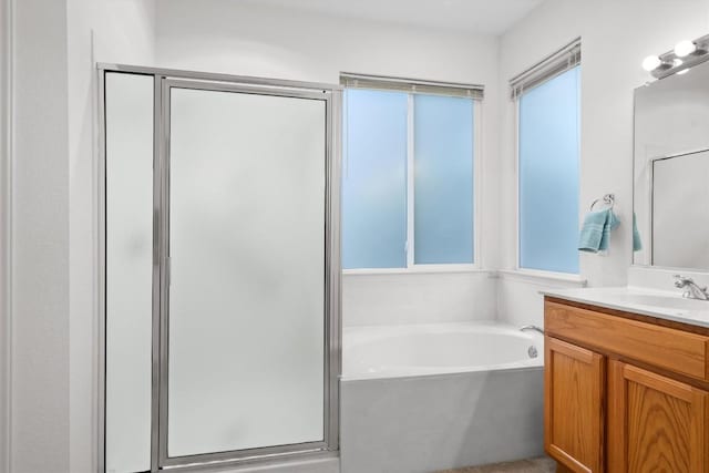 106 Ranch House Cv, Georgetown, TX 78633 - full bath with a stall shower, vanity, and a garden tub