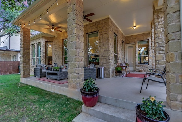 view of patio / terrace with fence and ceiling fan