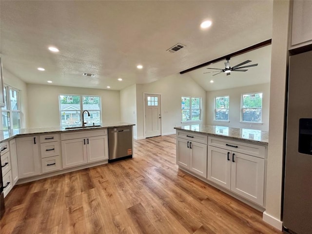 1127 Greenhill Dr, Canyon Lake, TX 78133 - kitchen with appliances with stainless steel finishes, light wood finished floors, recessed lighting, white cabinetry, and a ceiling fan